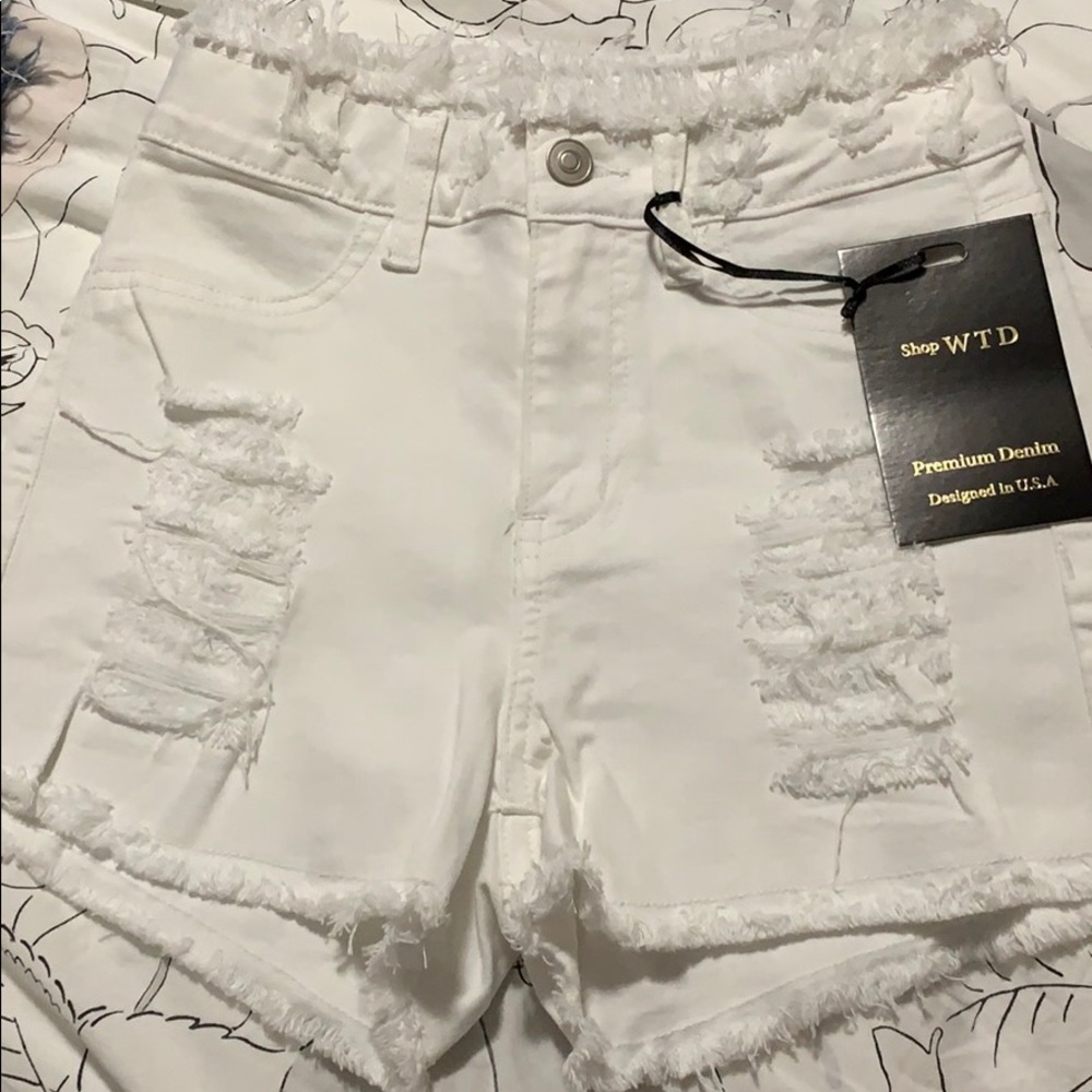 White shorts with distress